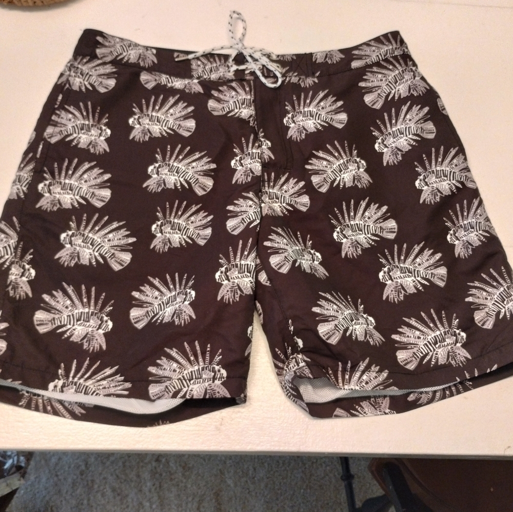Men's Express brown swim trunks with piranhas on them size Medium